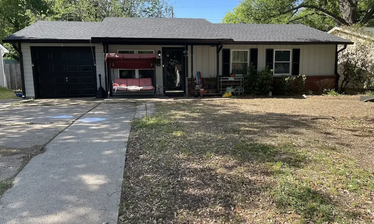 Wind Damage Roof Repair crew at work on a residential roof in D'Iberville